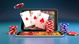 Live dealer revealing cards at Three Card Poker table